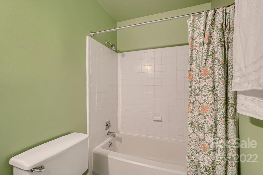 11320 Park Road Charlotte, NC 28226 - Photo 16 of 28 a bathroom with a shower curtain and a toilet