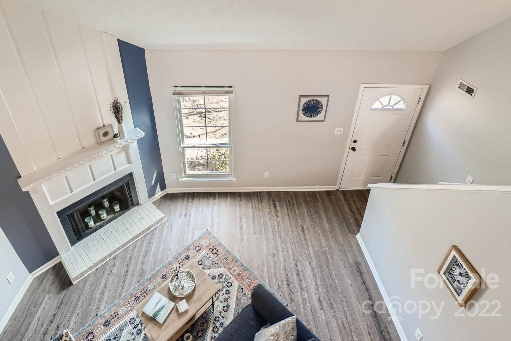 11320 Park Road Charlotte, NC 28226 - Photo 20 of 28 a view of furniture and bedroom with wooden floor
