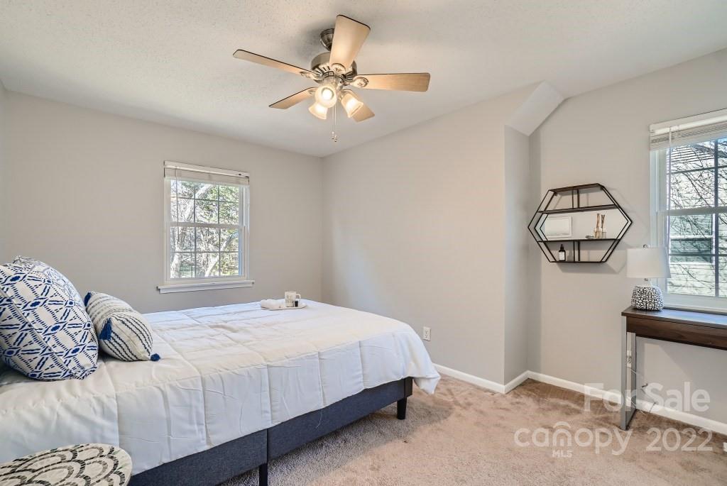 11320 Park Road Charlotte, NC 28226 - Photo 21 of 28 a bedroom with a large bed and a window