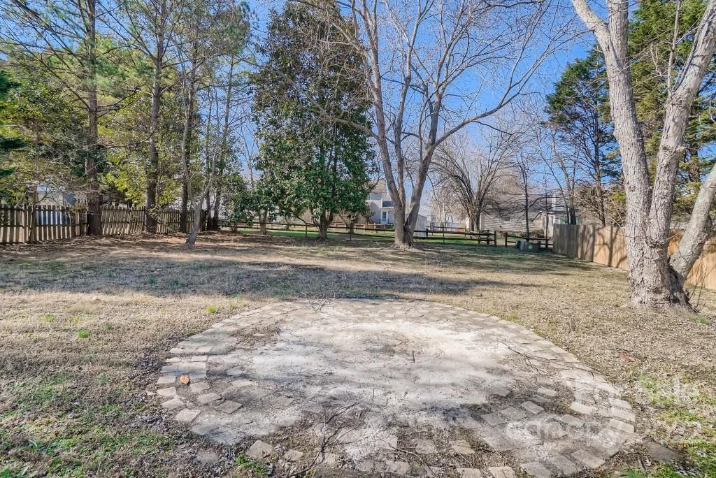 11320 Park Road Charlotte, NC 28226 - Photo 26 of 28 a view of dirt yard with a large tree