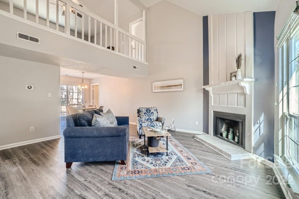 11320 Park Road Charlotte, NC 28226 - Photo 4 of 28 a living room with furniture and a fireplace