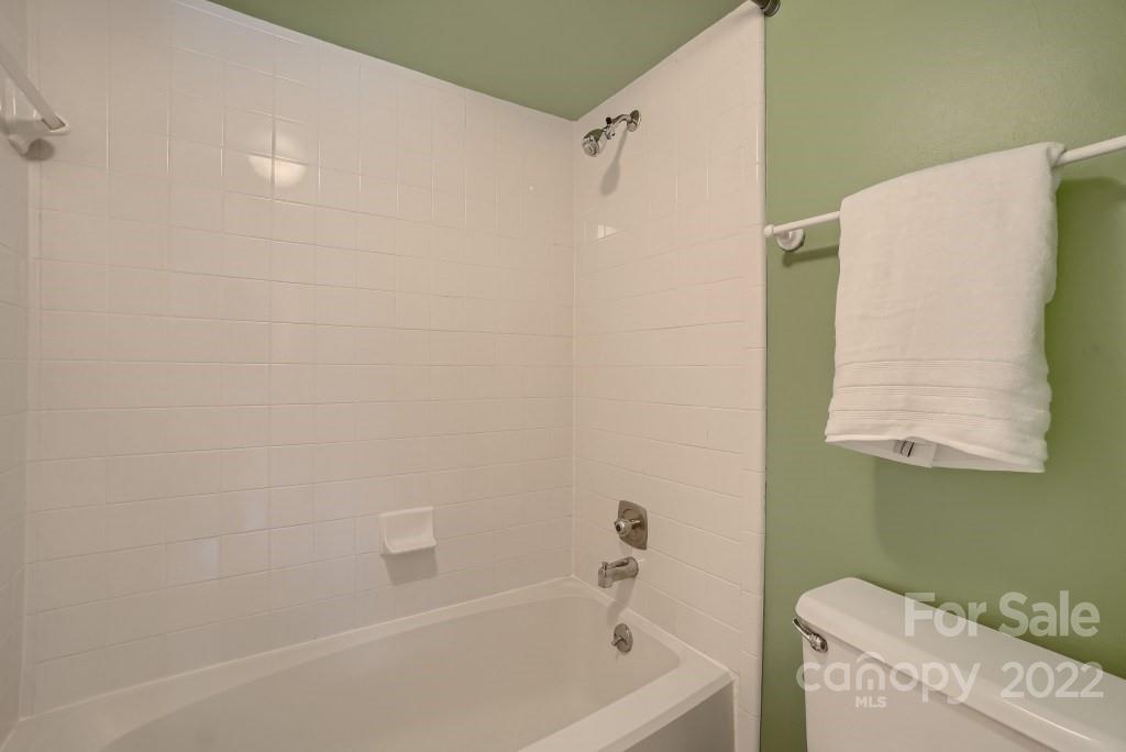 11320 Park Road Charlotte, NC 28226 - Photo 10 of 28 a bathroom with a bathtub and a shower