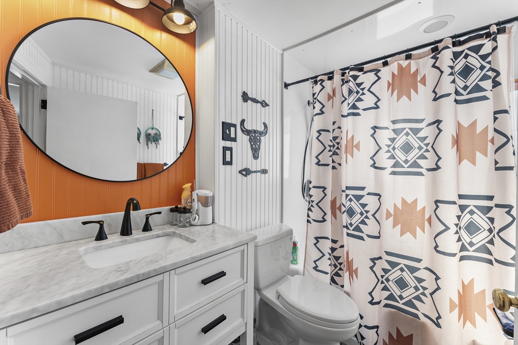 74 Benson Street Whitman, MA 02382 - Photo 16 of 30 a bathroom with a sink and a mirror