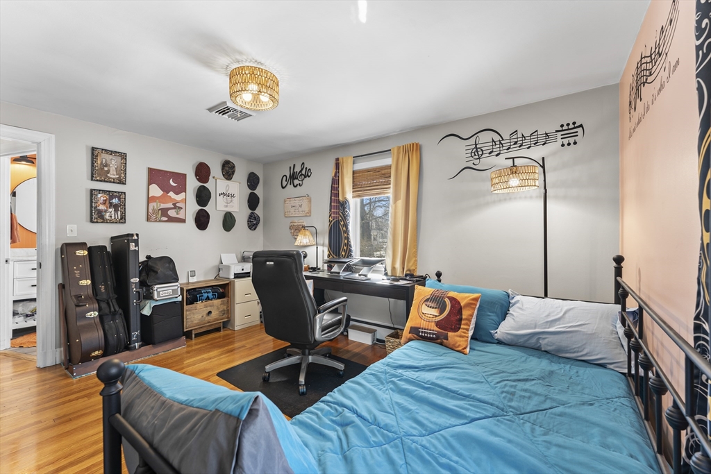 74 Benson Street Whitman, MA 02382 - Photo 22 of 30 a bedroom with furniture and wooden floor