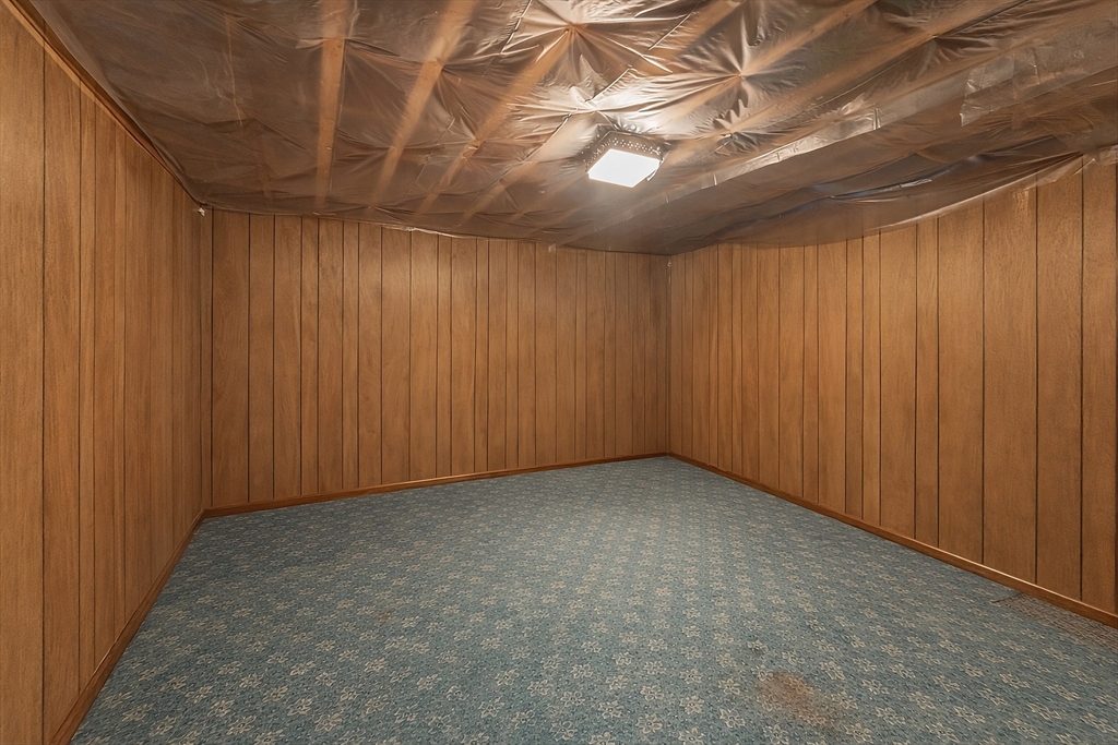 74 Benson Street Whitman, MA 02382 - Photo 26 of 30 an empty room with a wooden walls