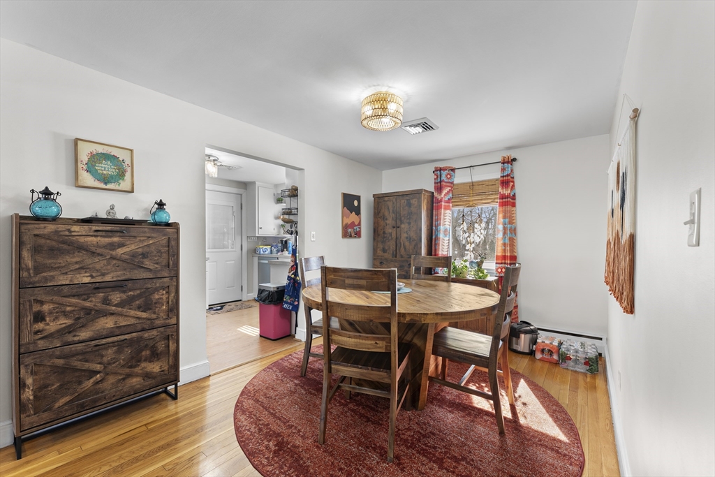74 Benson Street Whitman, MA 02382 - Photo 9 of 30 a view of a dining room with furniture window and wooden floor