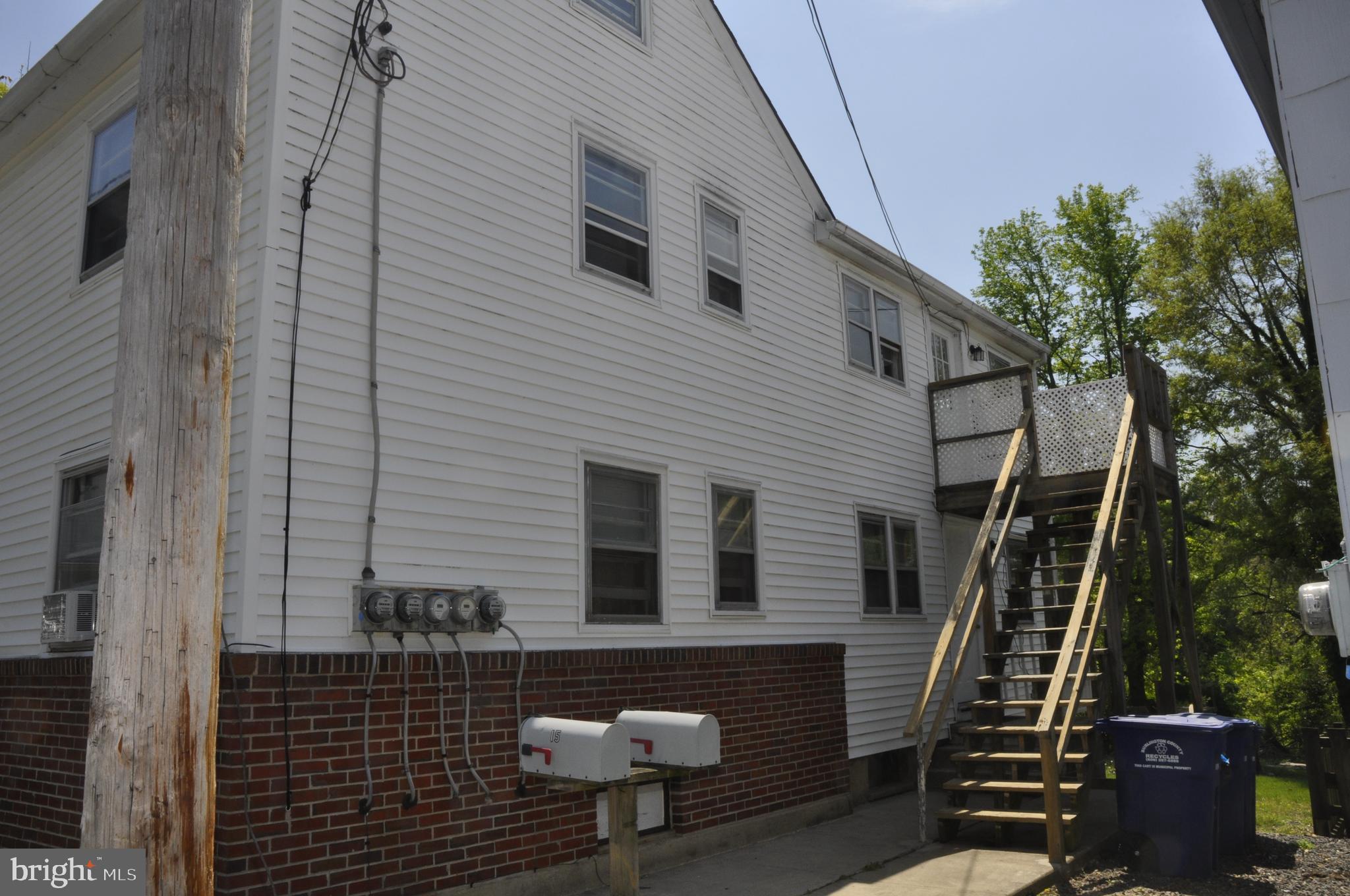 a front view of a house with stairs