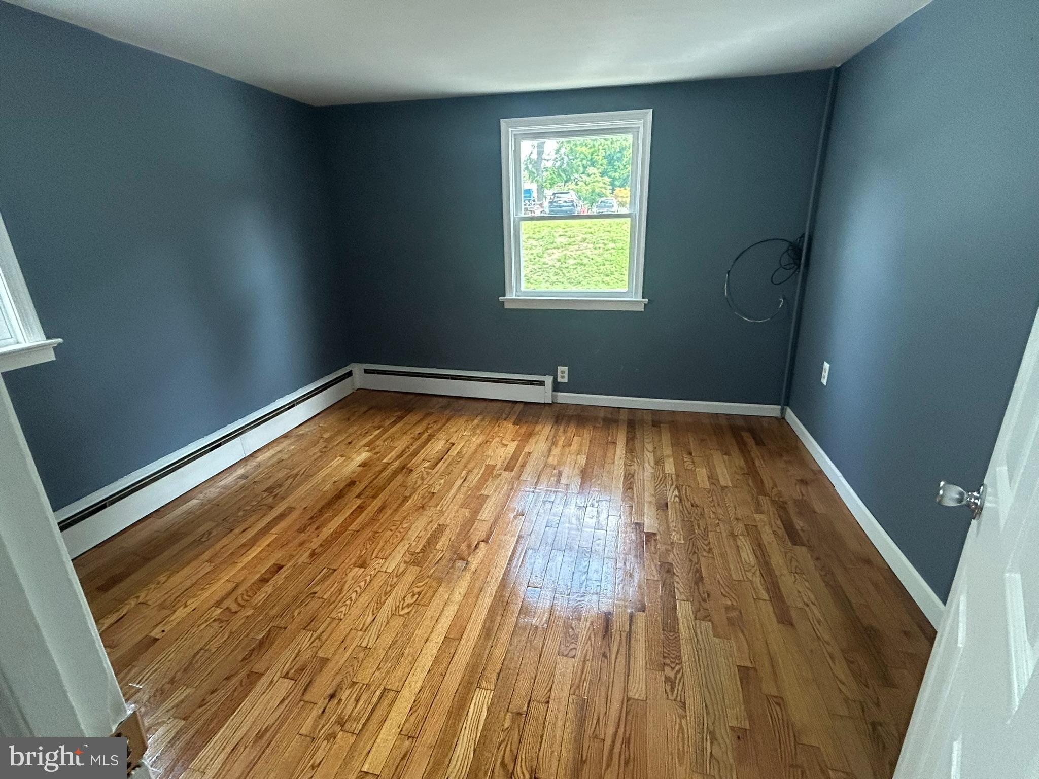 15 Mary Street Pemberton, NJ 08068 - Photo 7 of 7 a view of empty room with wooden floor and fan