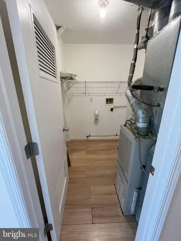 a view of room with wooden floor