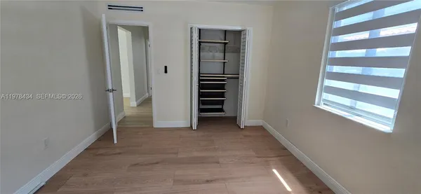 a view of walk in closet with window