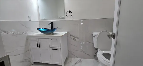 a bathroom with a shower and toilet