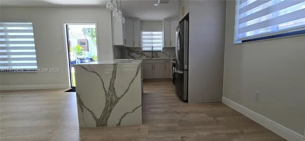 a view of a kitchen and a window