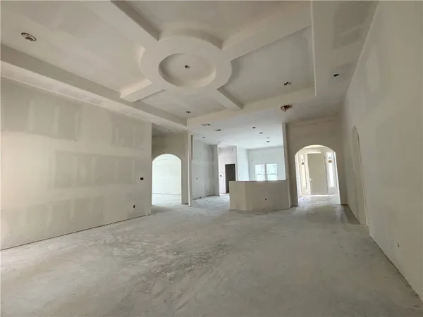 a view of a livingroom with a dishwasher and furniture