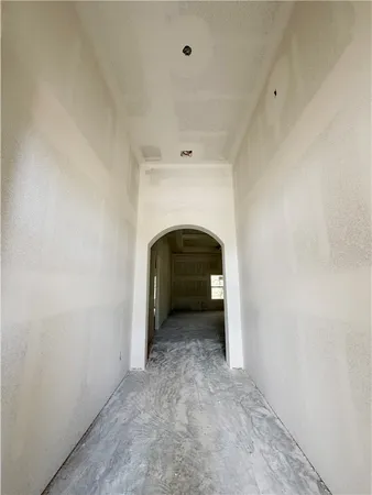 a view of an empty room with a fireplace
