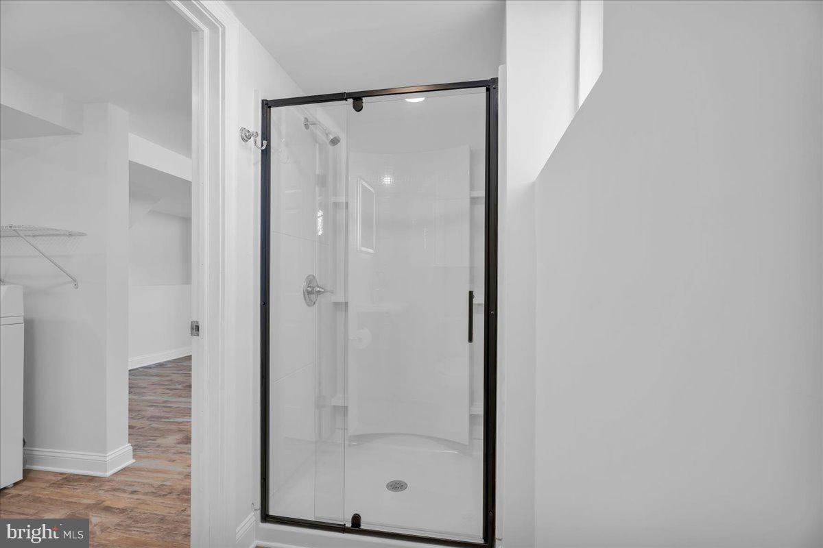 328 Keller Road Glendora, NJ 08029 - Photo 20 of 25 Sleek modern shower in bright space.