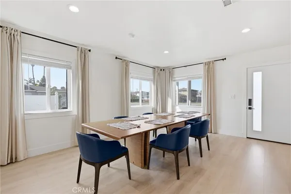 a kitchen with kitchen island granite countertop a sink stainless steel appliances and cabinets