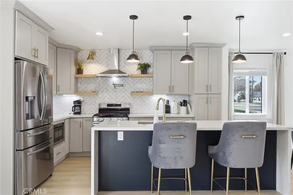 a bathroom with a sink a vanity a mirror and a bathtub