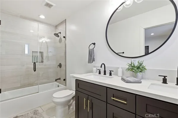 a bedroom with a bed and hallway