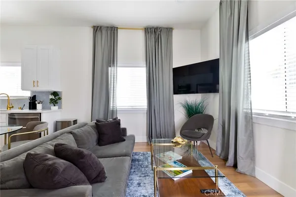 a bedroom with a bed and painting on the wall