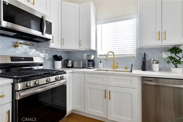 a bed room with a bed and a chair