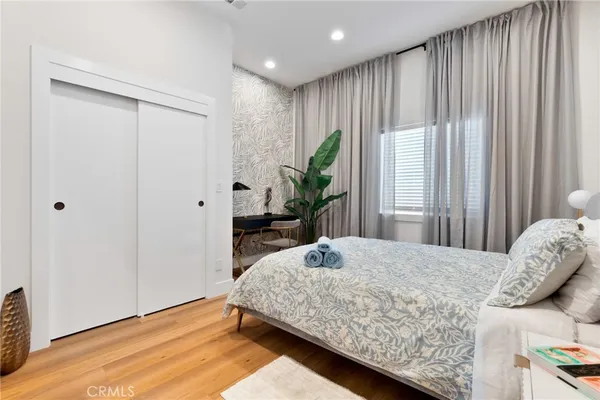 a bathroom with a shower sink vanity mirror and toilet