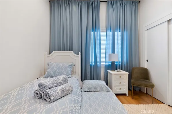 a bed room with a bed and a night stand