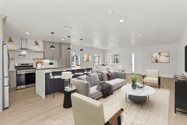 a dining room with furniture and wooden floor
