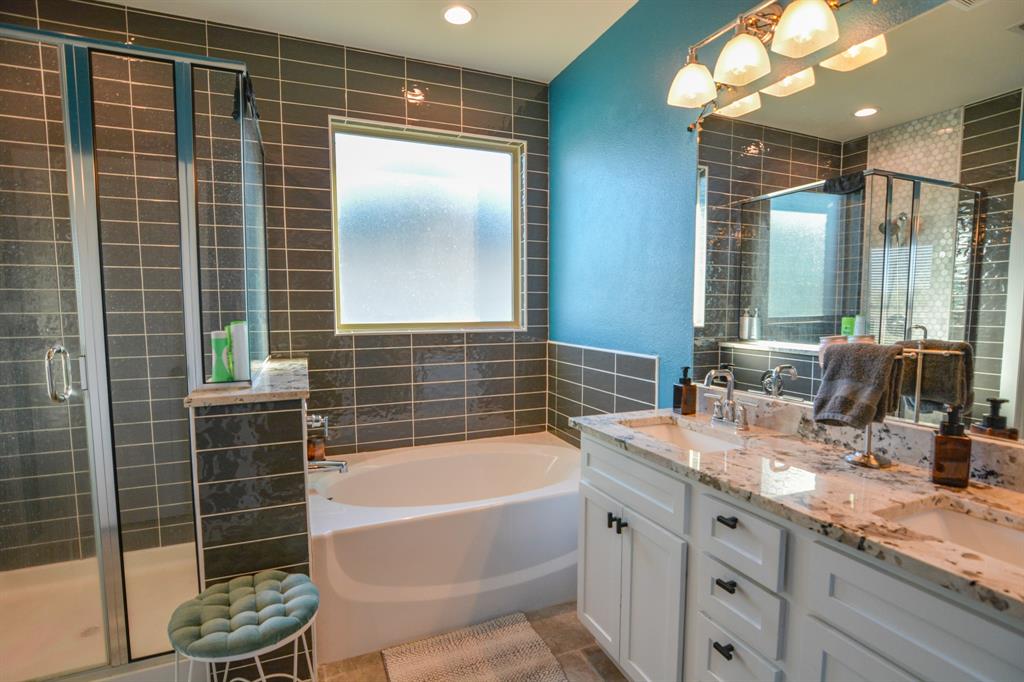 601 Mathew Street Grandview, TX 76050 - Photo 24 of 40 a bathroom with a granite countertop sink mirror and bathtub
