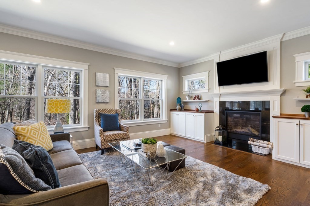 43 MacArthur Road Wellesley, MA 02482 - Photo 17 of 35 a living room with furniture fireplace and a flat screen tv