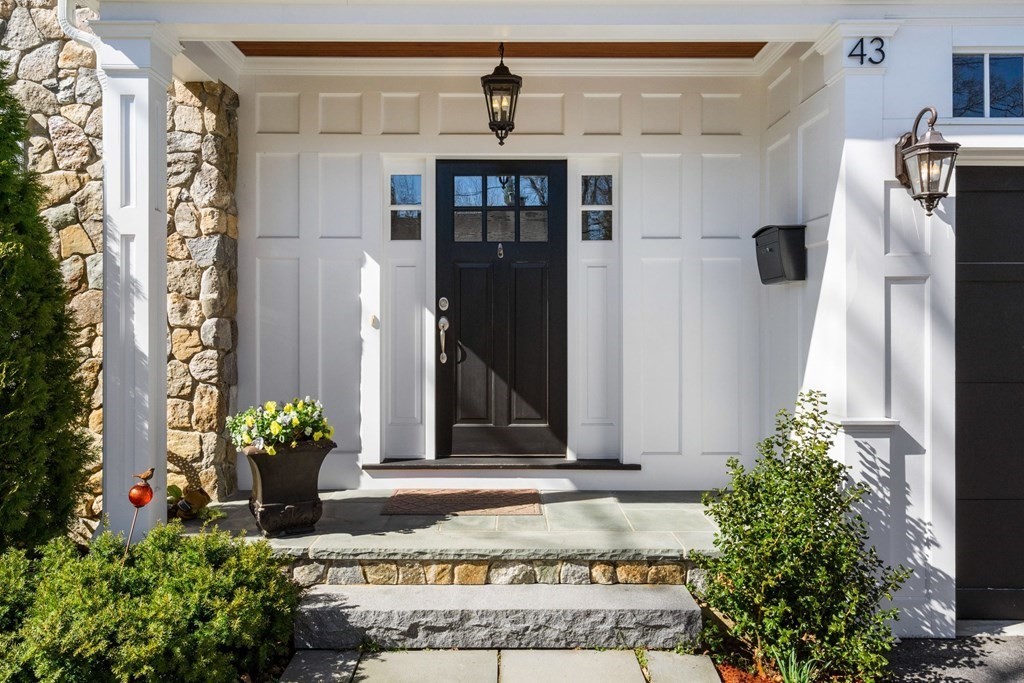 43 MacArthur Road Wellesley, MA 02482 - Photo 2 of 35 a front view of a house with a yard