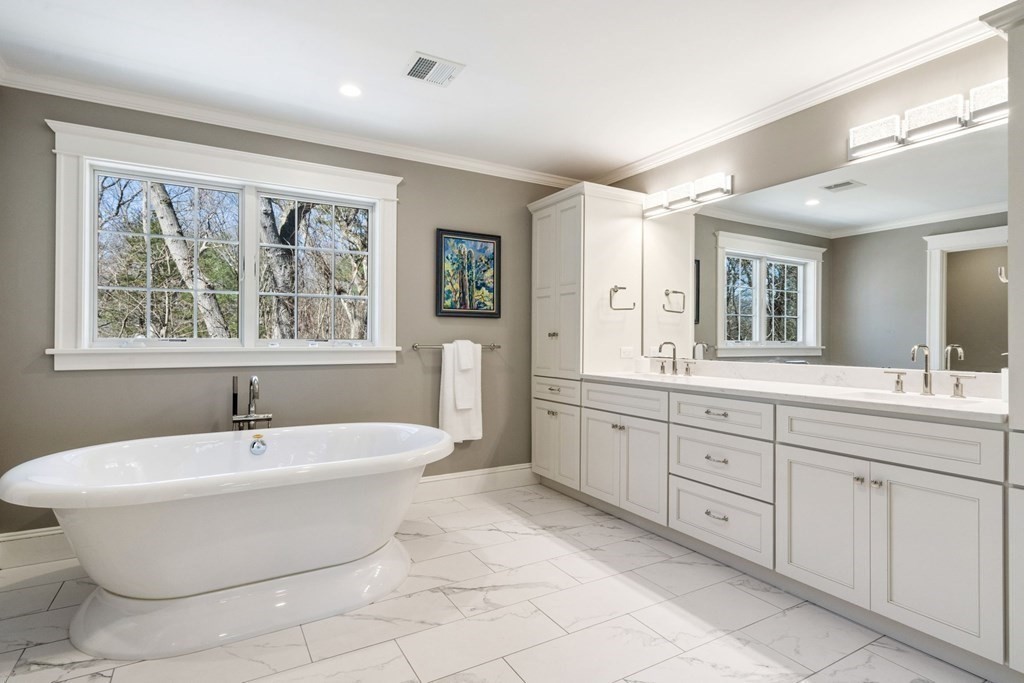 43 MacArthur Road Wellesley, MA 02482 - Photo 21 of 35 a spacious bathroom with a double vanity sink a mirror and a bathtub