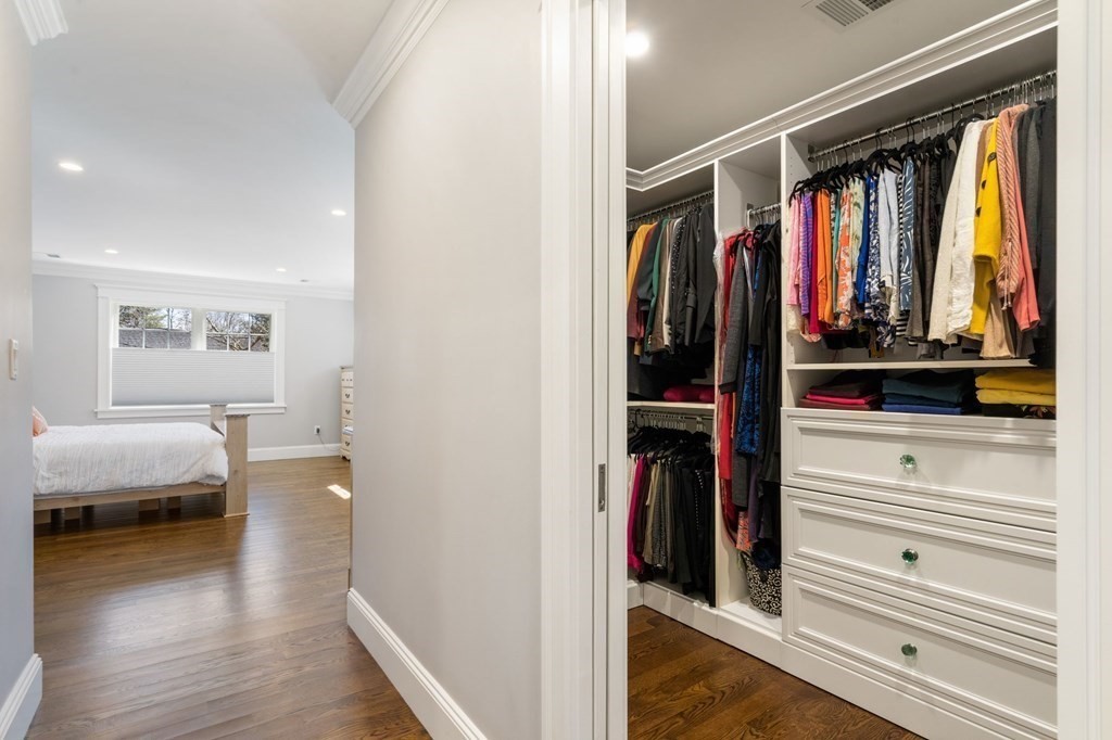 43 MacArthur Road Wellesley, MA 02482 - Photo 23 of 35 a view of walk in closet with clothes and shoes