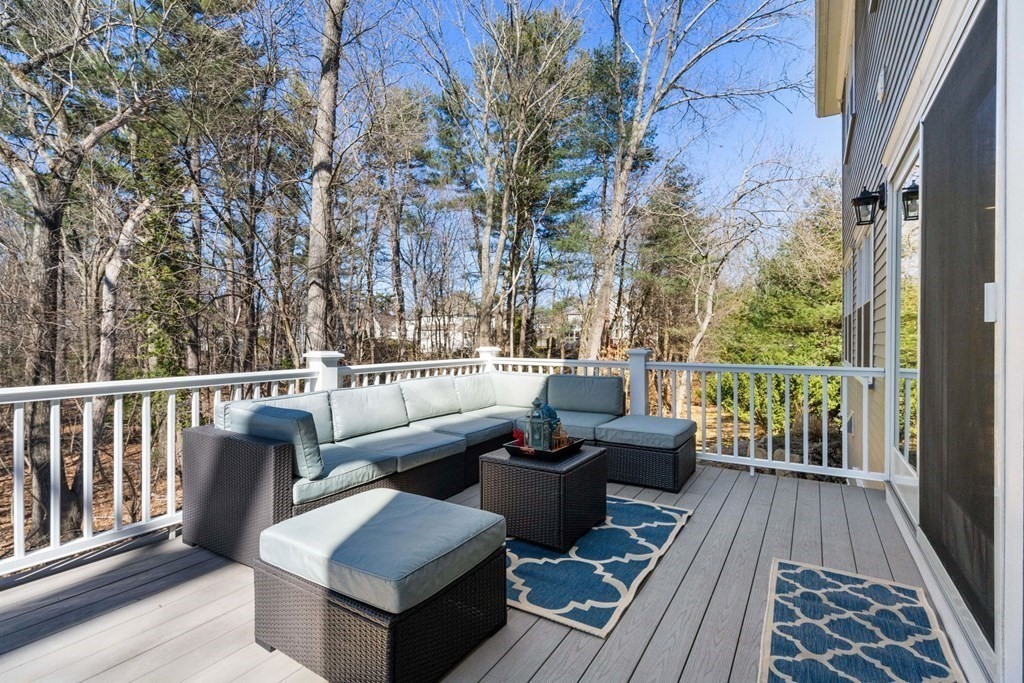 43 MacArthur Road Wellesley, MA 02482 - Photo 30 of 35 a view of balcony with couch and wooden floor