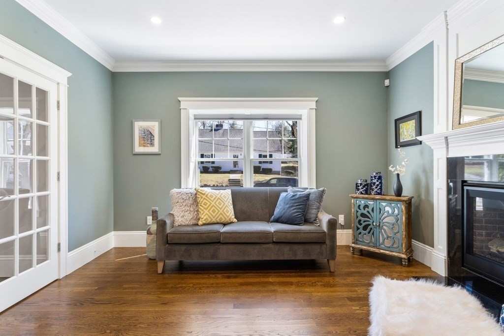 43 MacArthur Road Wellesley, MA 02482 - Photo 5 of 35 a living room with furniture and a fireplace