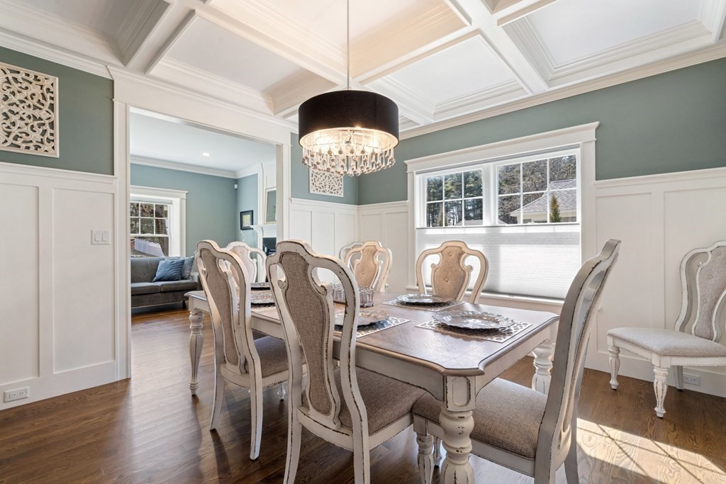 43 MacArthur Road Wellesley, MA 02482 - Photo 6 of 35 a view of a dining room with furniture a chandelier and wooden floor