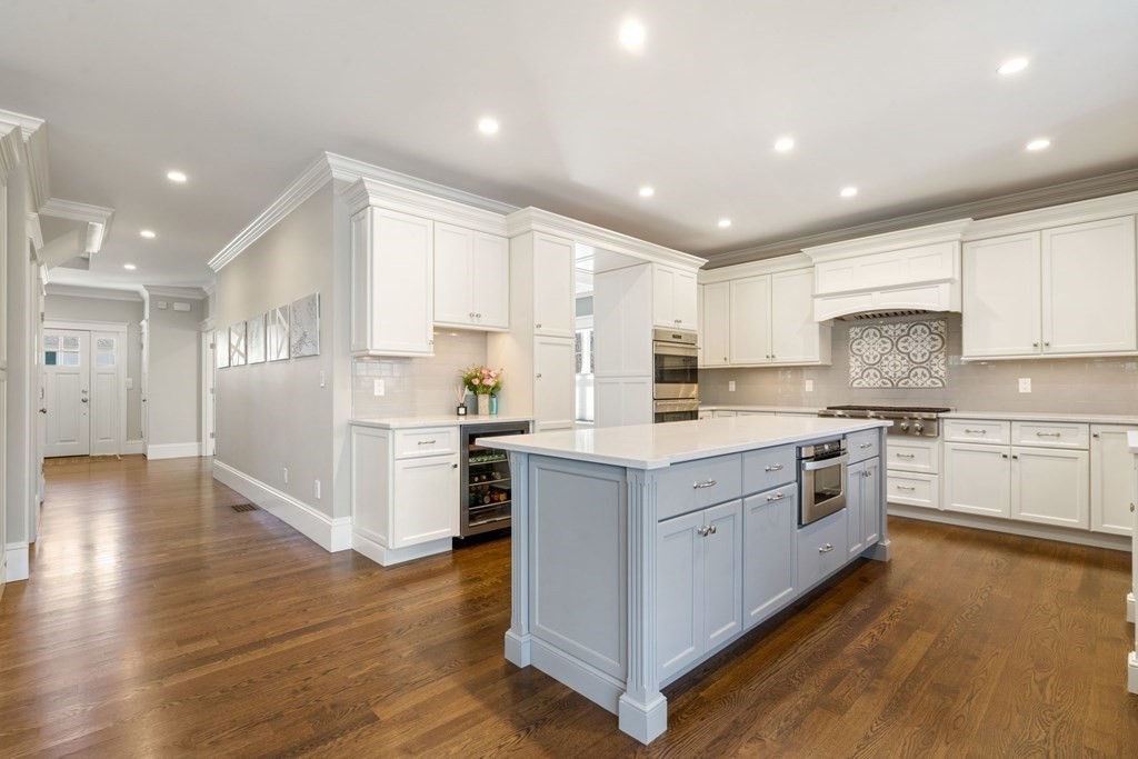 43 MacArthur Road Wellesley, MA 02482 - Photo 10 of 35 a kitchen with a white wooden cabinets and white stainless steel appliances