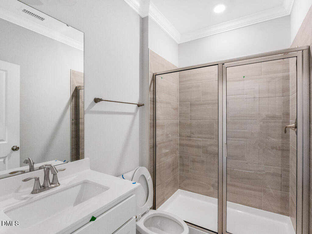 348 Canyon Gap Way Raleigh, NC 27610 - Photo 12 of 33 a bathroom with a granite countertop sink toilet and shower