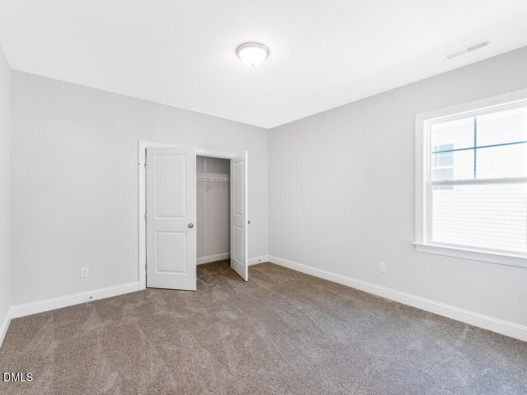 348 Canyon Gap Way Raleigh, NC 27610 - Photo 23 of 33 a view of an empty room with a window