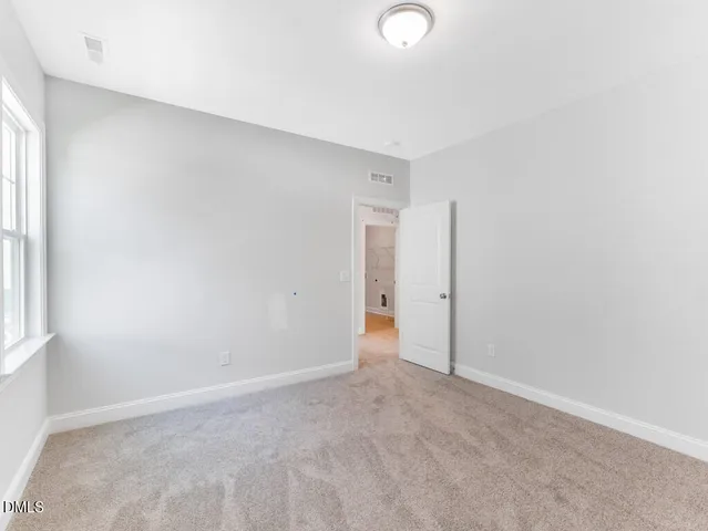 a white toilet sitting next to a shower