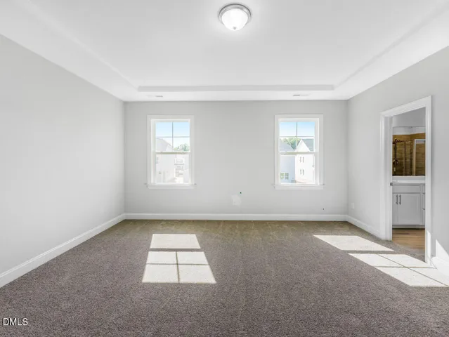 a view of a living room and a floor to ceiling window