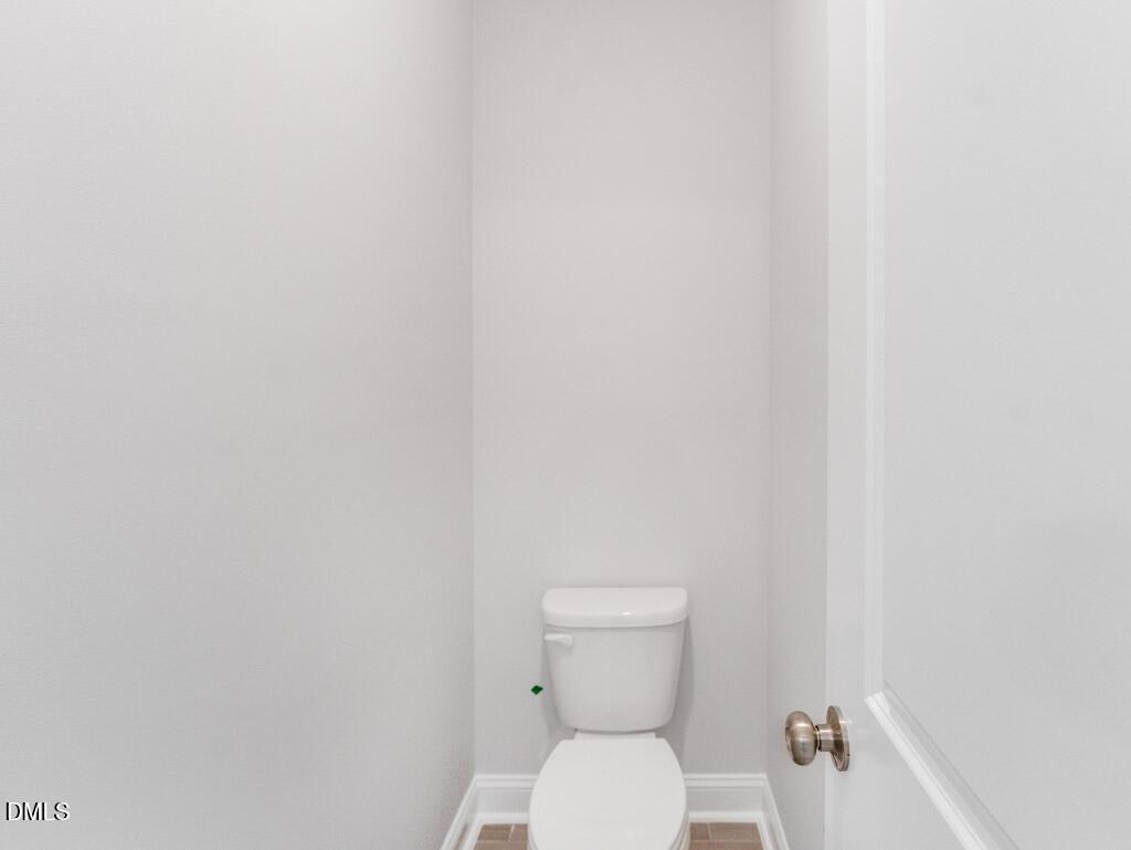 348 Canyon Gap Way Raleigh, NC 27610 - Photo 31 of 33 a white toilet sitting next to a shower