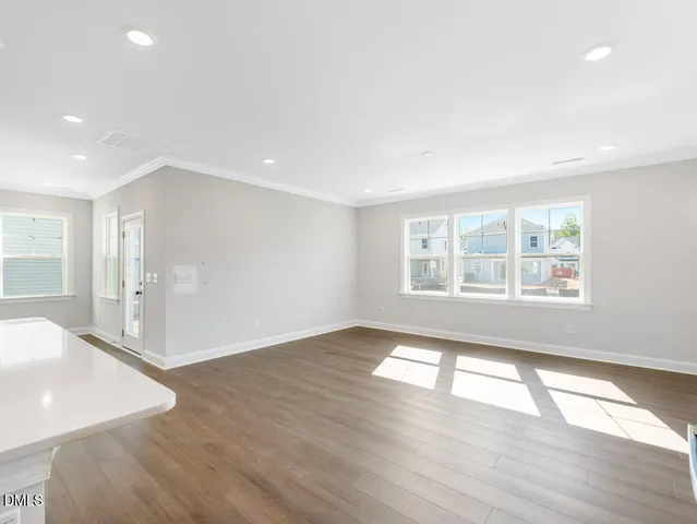 a white stove top oven sitting inside of a kitchen