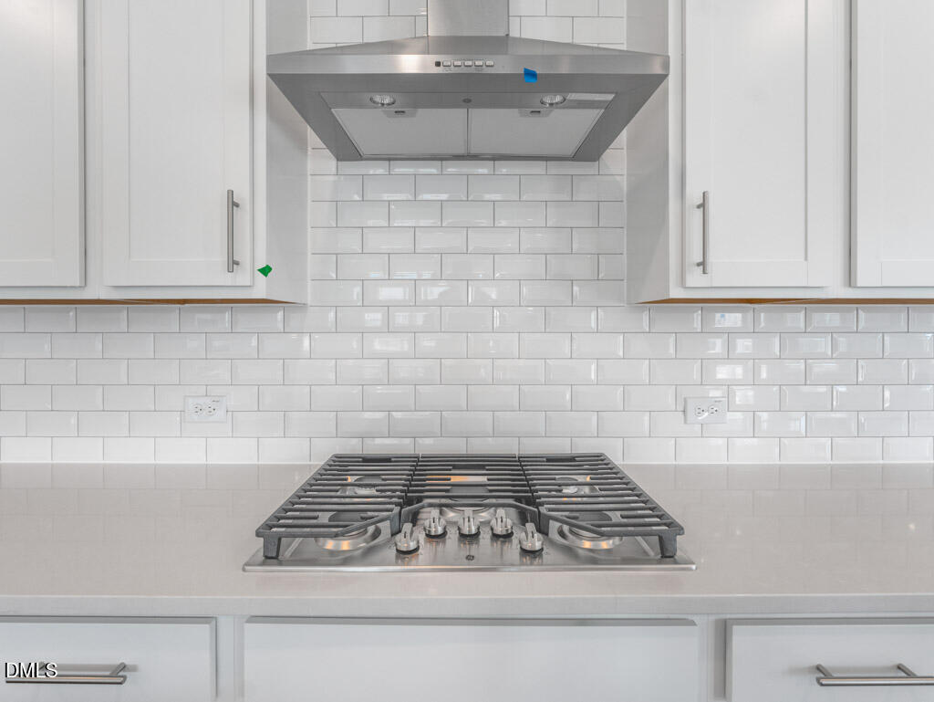 348 Canyon Gap Way Raleigh, NC 27610 - Photo 10 of 33 a white stove top oven sitting inside of a kitchen