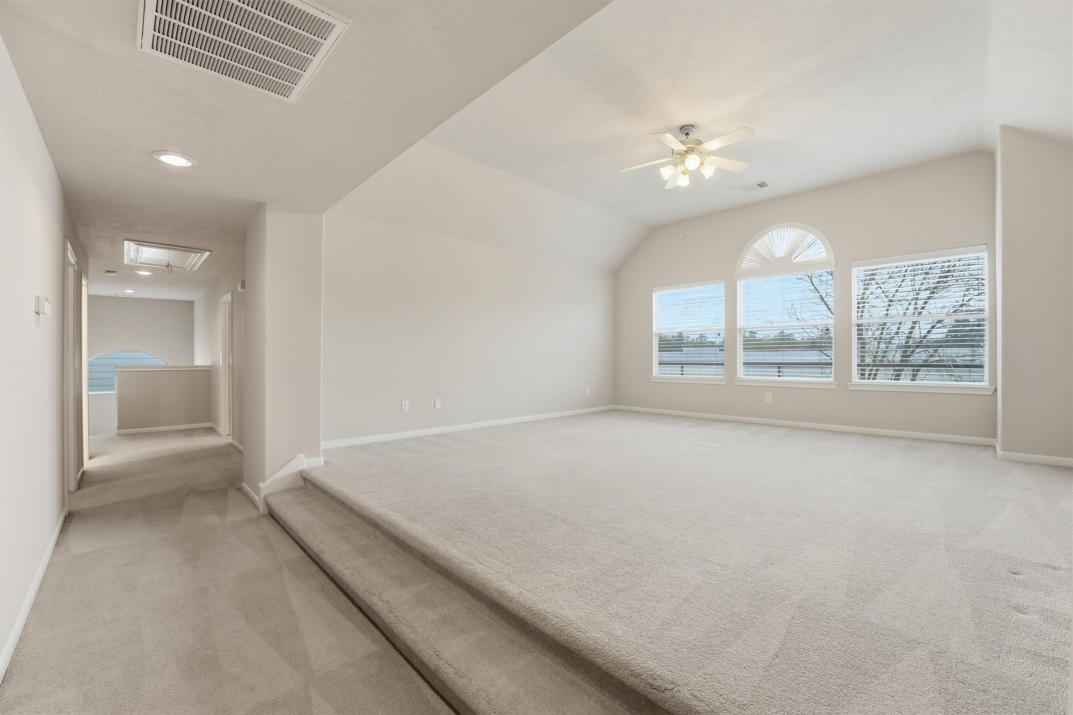 17415 Memorial Mills Drive Spring, TX 77379 - Photo 22 of 37 View from the top of the grand staircase looking down the upstairs hallway past the large game/media room and secondary bedrooms to the secondary staircase. Superbly functional/flexible layout!
