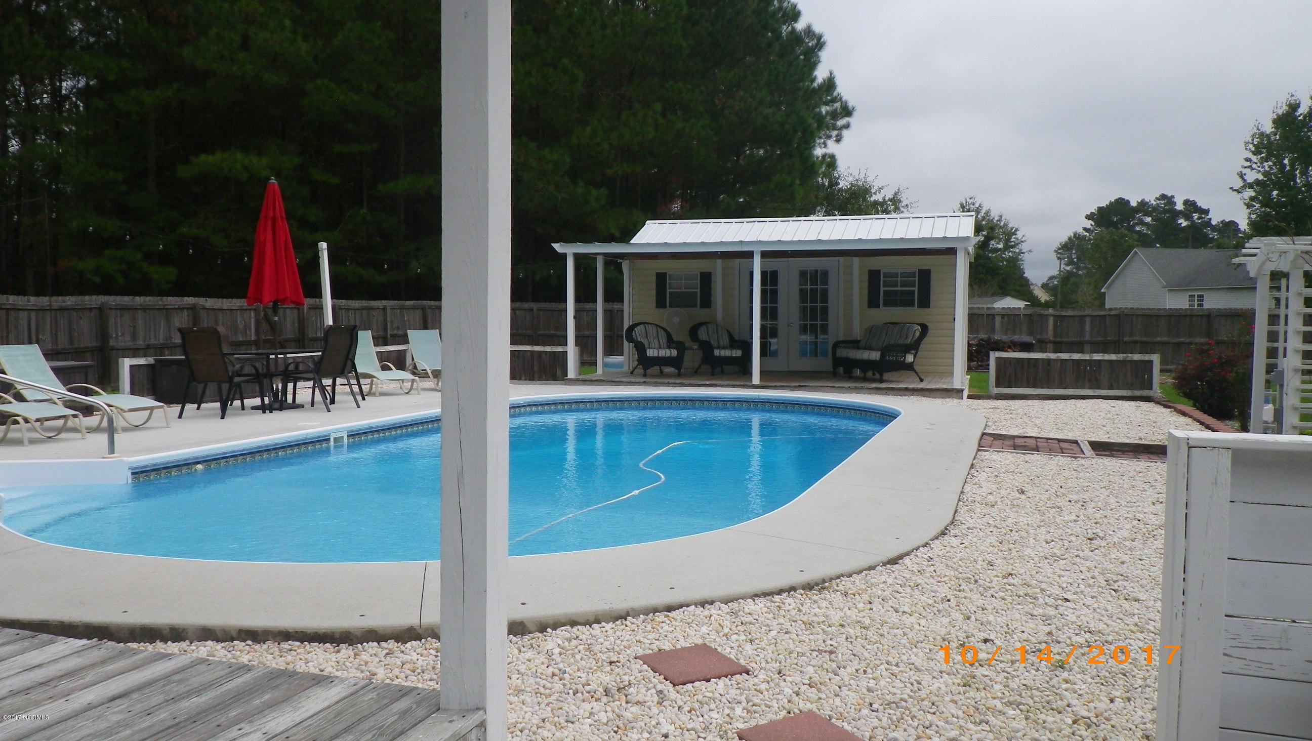 1247 North Bryan Road Jacksonville, NC 28546 - Photo 31 of 32 Pool with heated and cooled poolhouse