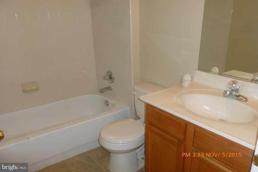 1908 Gardenia Court Odenton, MD 21113 - Photo 12 of 23 a bathroom with a sink toilet vanity and bathtub