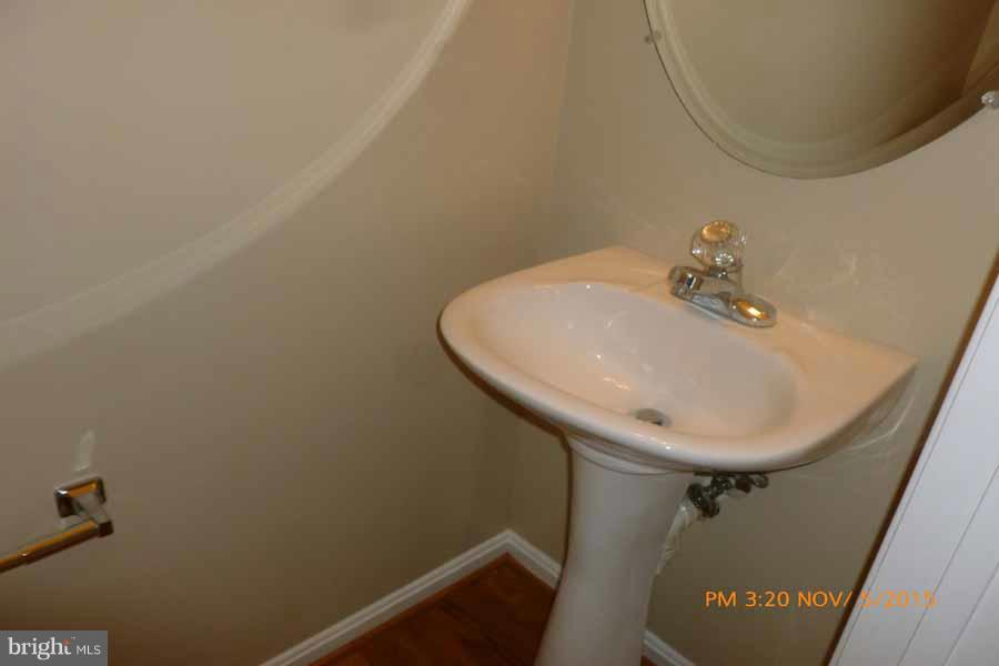 1908 Gardenia Court Odenton, MD 21113 - Photo 5 of 23 a bathroom with a sink and mirror