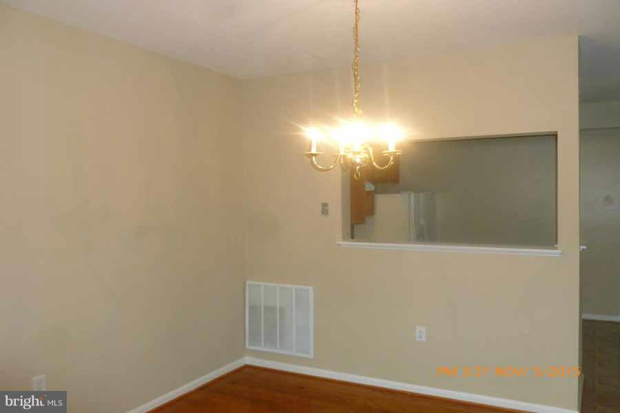 1908 Gardenia Court Odenton, MD 21113 - Photo 6 of 23 a view of a room with a hanging light and a window