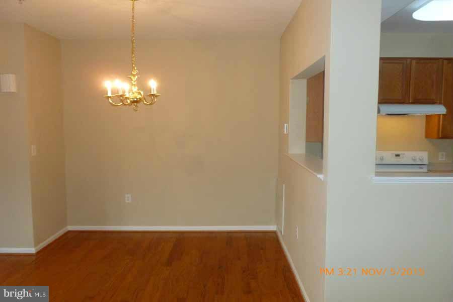 1908 Gardenia Court Odenton, MD 21113 - Photo 7 of 23 a view of an empty room with a chandelier fan