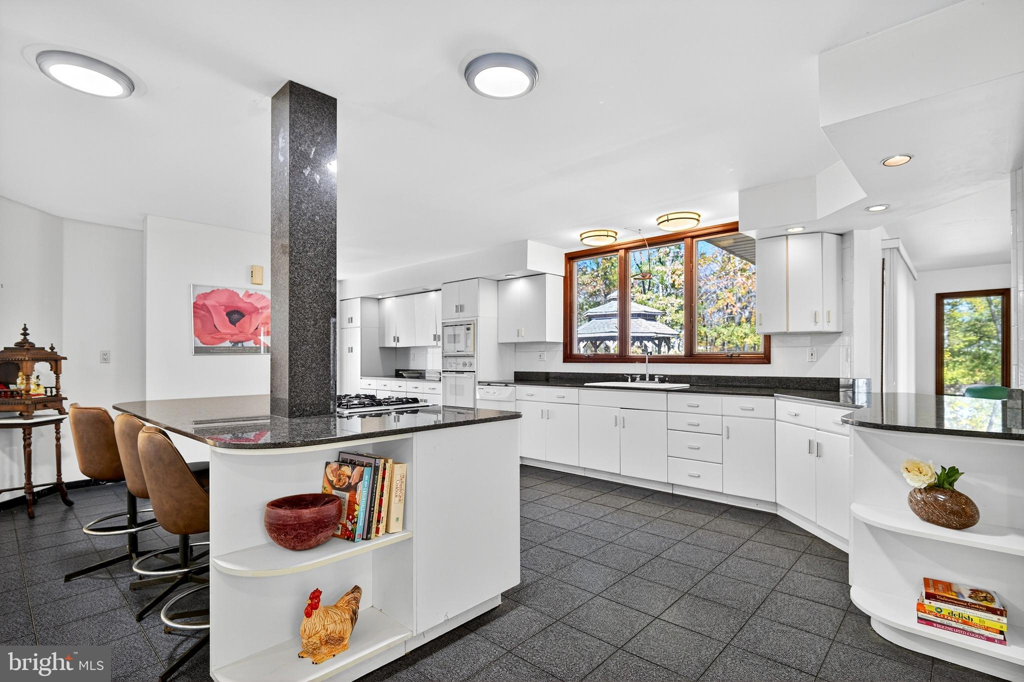 16 Benedek Road Princeton, NJ 08540 - Photo 17 of 60 a kitchen with a sink stove and cabinets